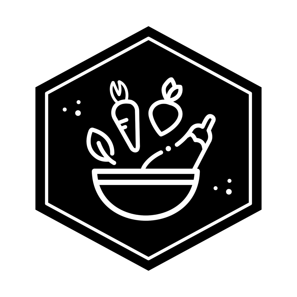 Hexagon icon showing for the Culinary Adventures major, featuring a leaf, carrot, turnip, and eggplant within a bowl.