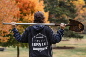 A Purdue Day of Service volunteer admiring a job well done!