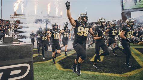 Purdue's football team running onto the field for a Purdue football game