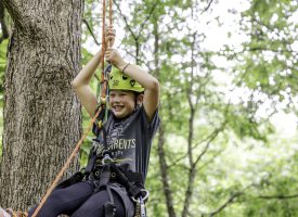 A child zip lining at a GPU event